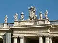 There are many statues on the colonnade and roof.
