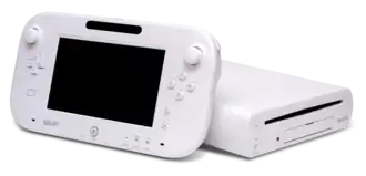 A white Wii U GamePad next to its Wii U, with the GamePad leaning against the console