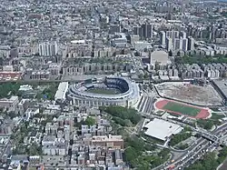 Yankee Stadium (center), Bronx County Courthouse and the Grand Concourse towards the top. To the right of the current stadium is the site of its predecessor.