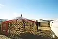 Mongolian Ger: placing the thin inner cover on the roof